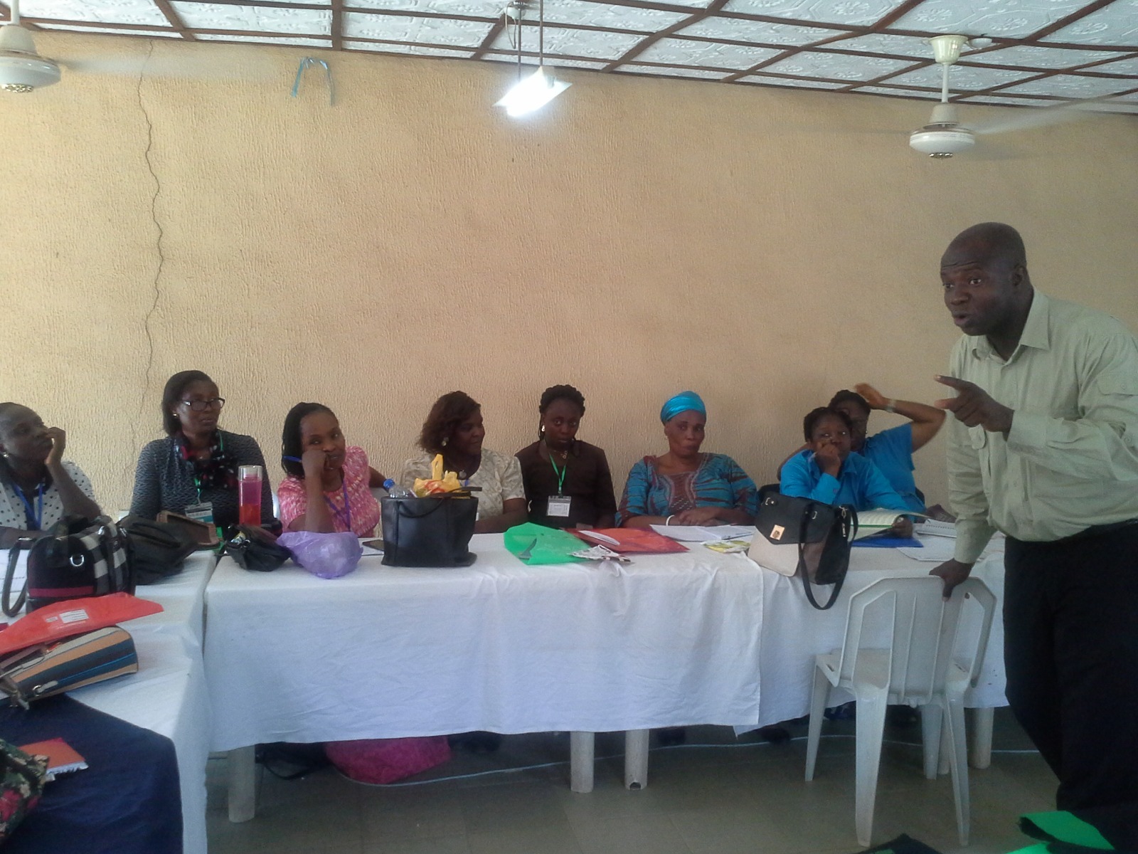A trainer speaking at a Helimax community health seminar